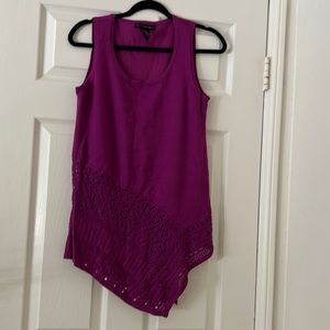 Sleeveless tunic length sweater.
